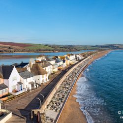 Pretty cottages at Torcross on the Devon coast, the village sits on a strip of land overlooking Slapton Sands beach with a fresh water lake behind.